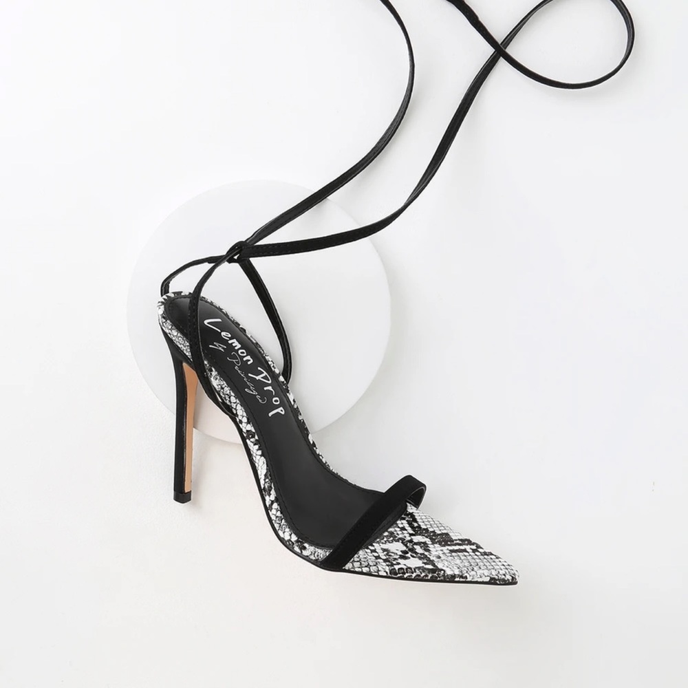 New black and white snake print pointed toe heel. Opened toe . wrap up straps